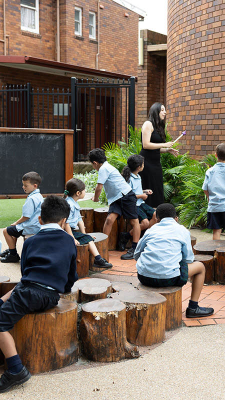 St Patrick's Guildford students sitting outdoors