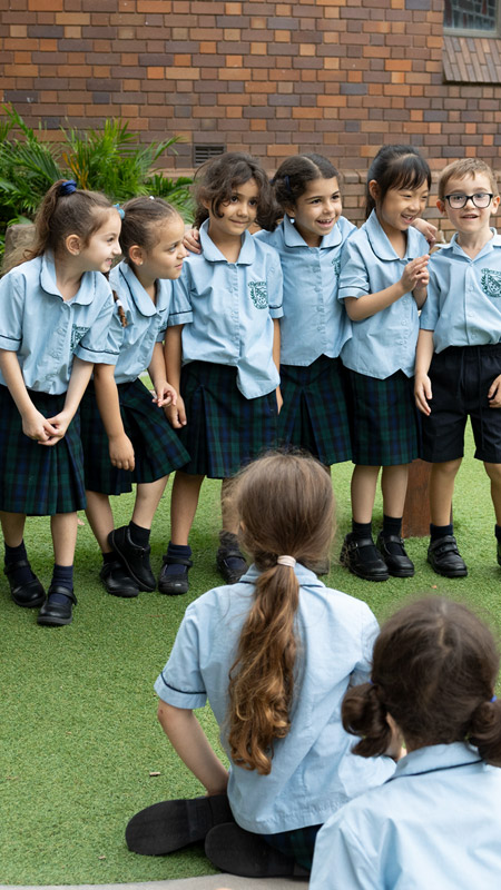 Happy students learning outdoors at St Patrick's Catholic Primary Guildford