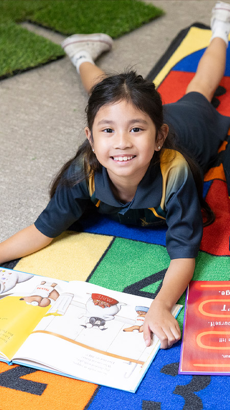 St Patrick's Primary Guildford Student in library
