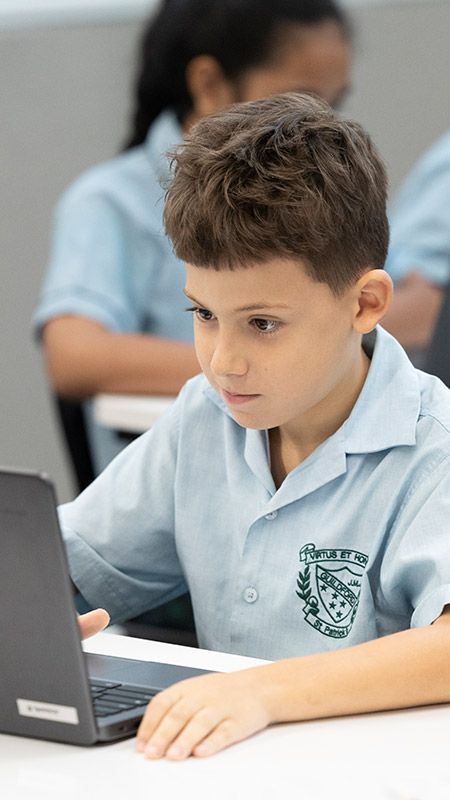 St Patrick's Primary Guildford student using laptop