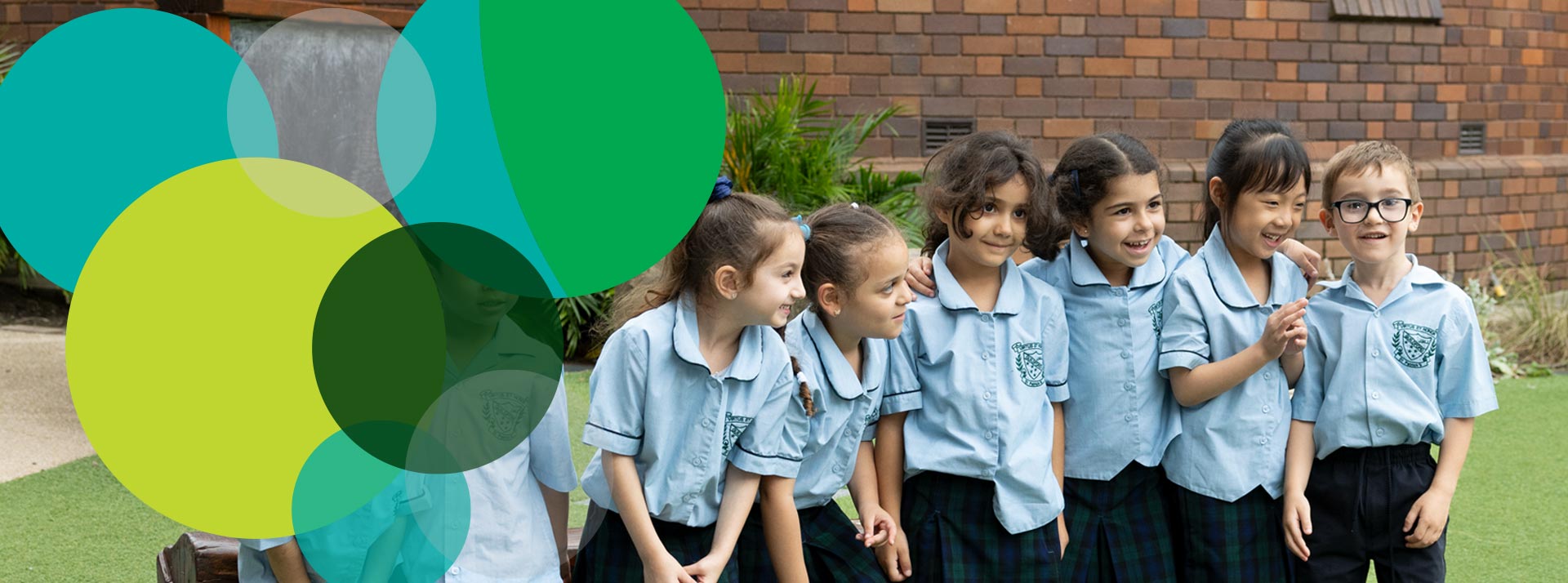 Happy students learning outdoors at St Patrick's Catholic Primary Guildford