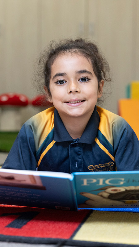 St Pat's Guildford girl reading in library