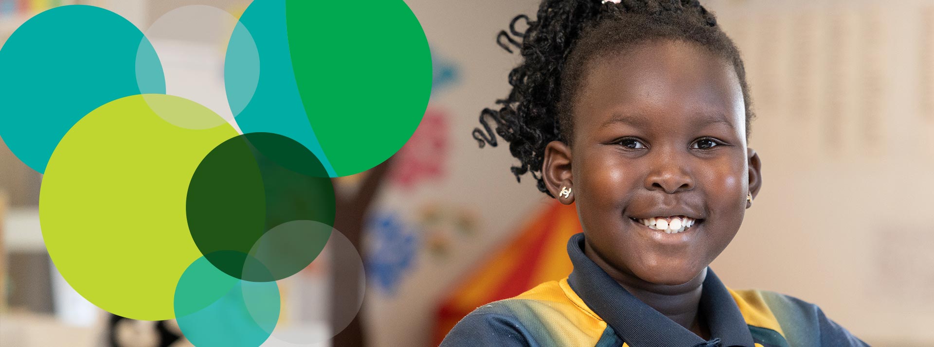 Smiling student in class at St Patrick's Primary Guildford