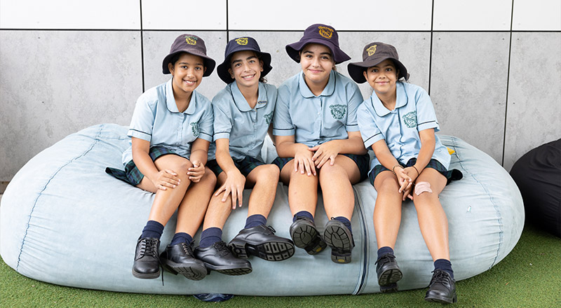 St Patrick's Catholic Primary Guildford students sitting outdoors