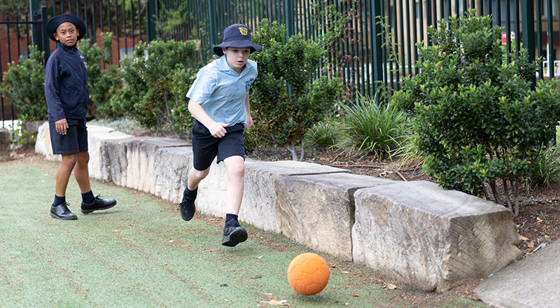 St Patricks Catholic Primary School Guildford student chasing a ball
