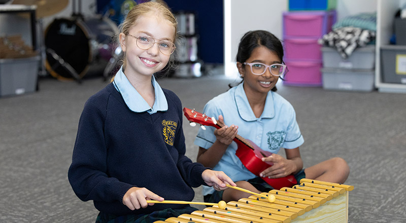 St Patrick's Primary Guildford music room. Two students are playing instruments