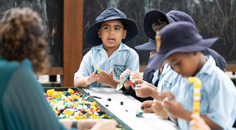 St Patrick's Primary Guildford play equipment, students are playing lego, there is a chalkbaoard in the background