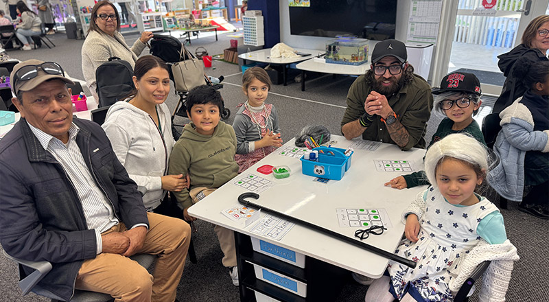 Parents assisting St Patrick's Primary Guildford students in class