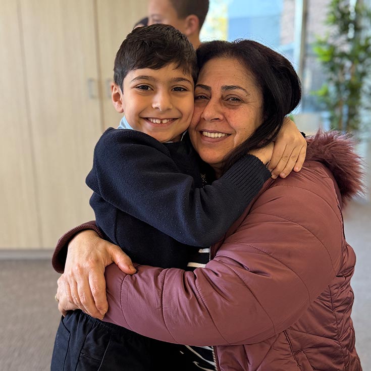 St Patrick's Guildford mum hugging her son
